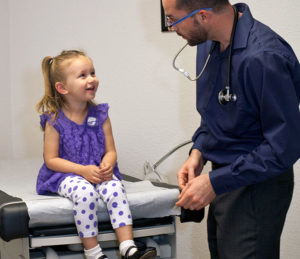 Dr. Bryan Dzvonick with pediatric patient at California Naturopathic Clinic