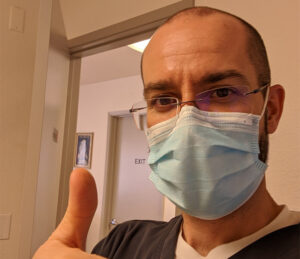 Dr. Dzvonick wearing mask at California Naturopathic Clinic